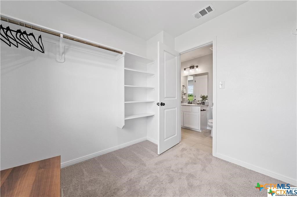 746 Meiomi Drive Temple, TX 76502 - Photo 19 of 32 a view of a kitchen with white cabinets