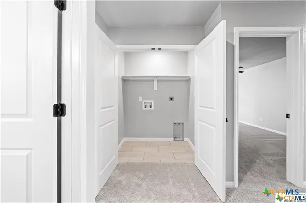 a view of a bathroom with sink shower and closet