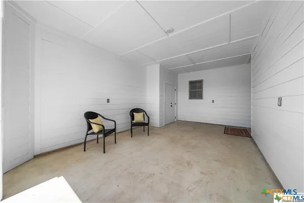 a view of a livingroom and a dishwasher in a room