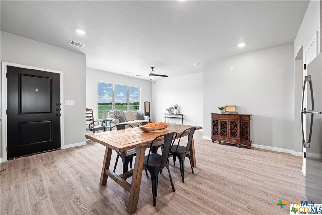 746 Meiomi Drive Temple, TX 76502 - Photo 9 of 32 a view of a dining room with furniture window and wooden floor