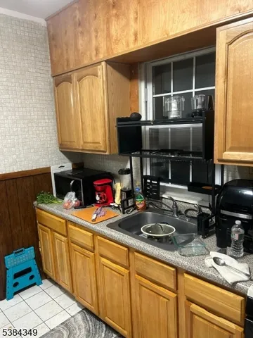 a kitchen with sink and cabinets