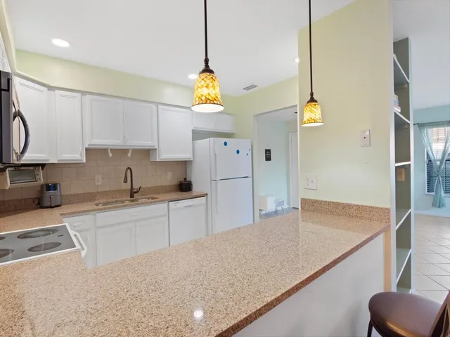 a view of a room with a large window