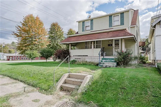 front view of a house with a yard