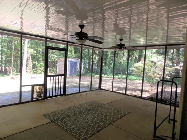 a bedroom with a large bed and a large window