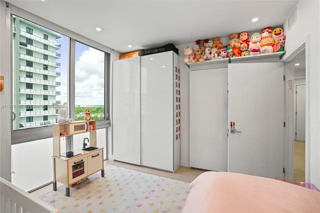 a bedroom with bed and a window