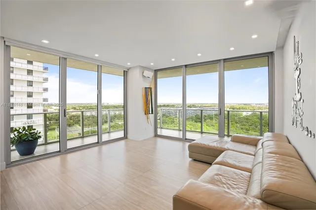 a living room with couch and a large window