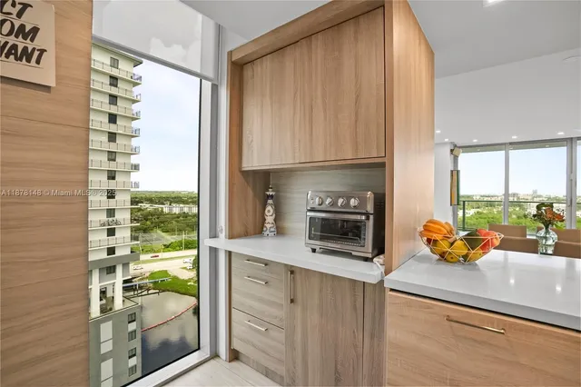 a kitchen with stainless steel appliances a refrigerator sink and cabinets