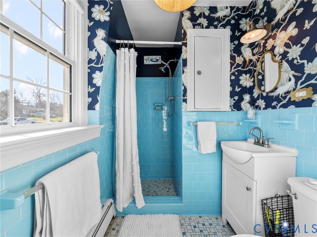 8636 Trabue Road Richmond, VA 23235 - Photo 27 of 50 Stylish wallpaper, new vanity, and a boho light fi