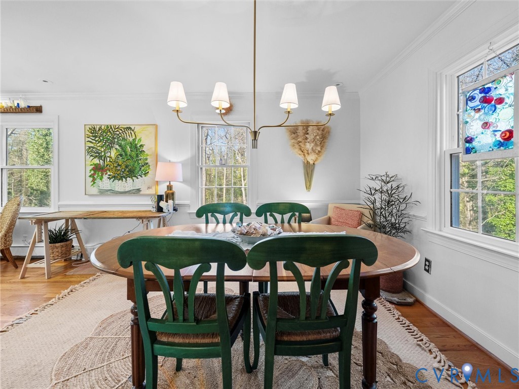 8636 Trabue Road Richmond, VA 23235 - Photo 9 of 50 Updated chandelier defines the dining room that op