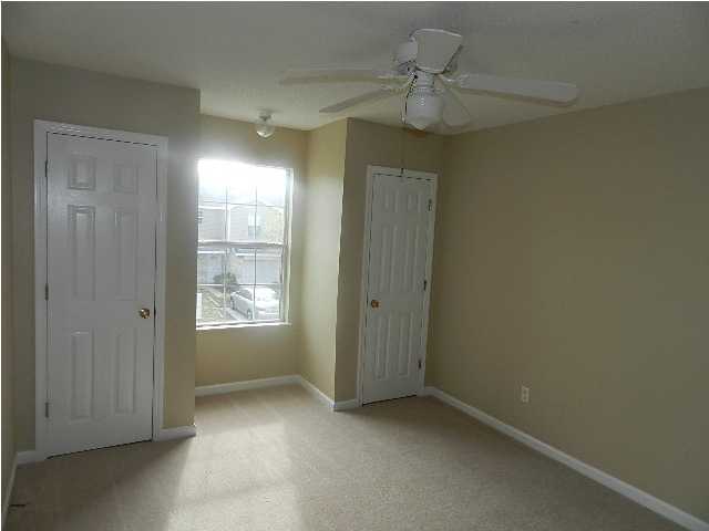 504 Keystone Road, Unit 504 Mary Esther, FL 32569 - Photo 13 of 20 an empty room with windows and closet