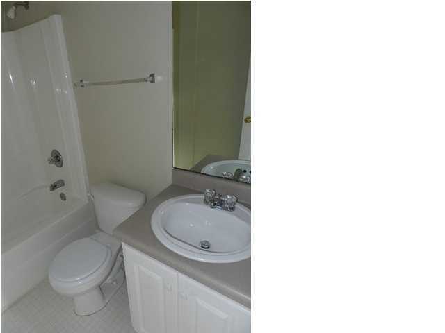 504 Keystone Road, Unit 504 Mary Esther, FL 32569 - Photo 18 of 20 a bathroom with a sink a toilet and shower