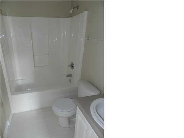 504 Keystone Road, Unit 504 Mary Esther, FL 32569 - Photo 19 of 20 a bathroom with a toilet and a shower