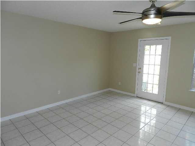 504 Keystone Road, Unit 504 Mary Esther, FL 32569 - Photo 4 of 20 an empty room with windows and fan