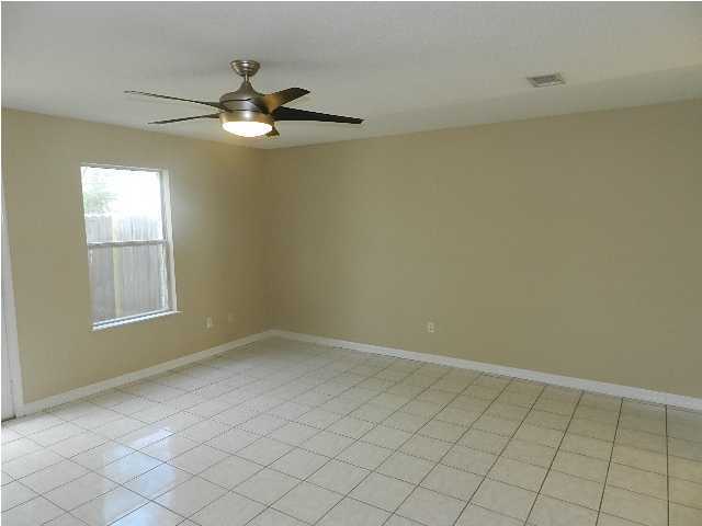 504 Keystone Road, Unit 504 Mary Esther, FL 32569 - Photo 5 of 20 an empty room with windows and fan