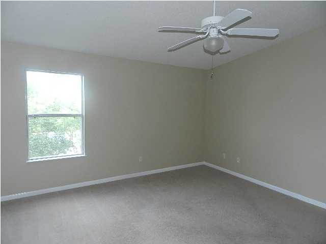 504 Keystone Road, Unit 504 Mary Esther, FL 32569 - Photo 8 of 20 an empty room with a window and a fan
