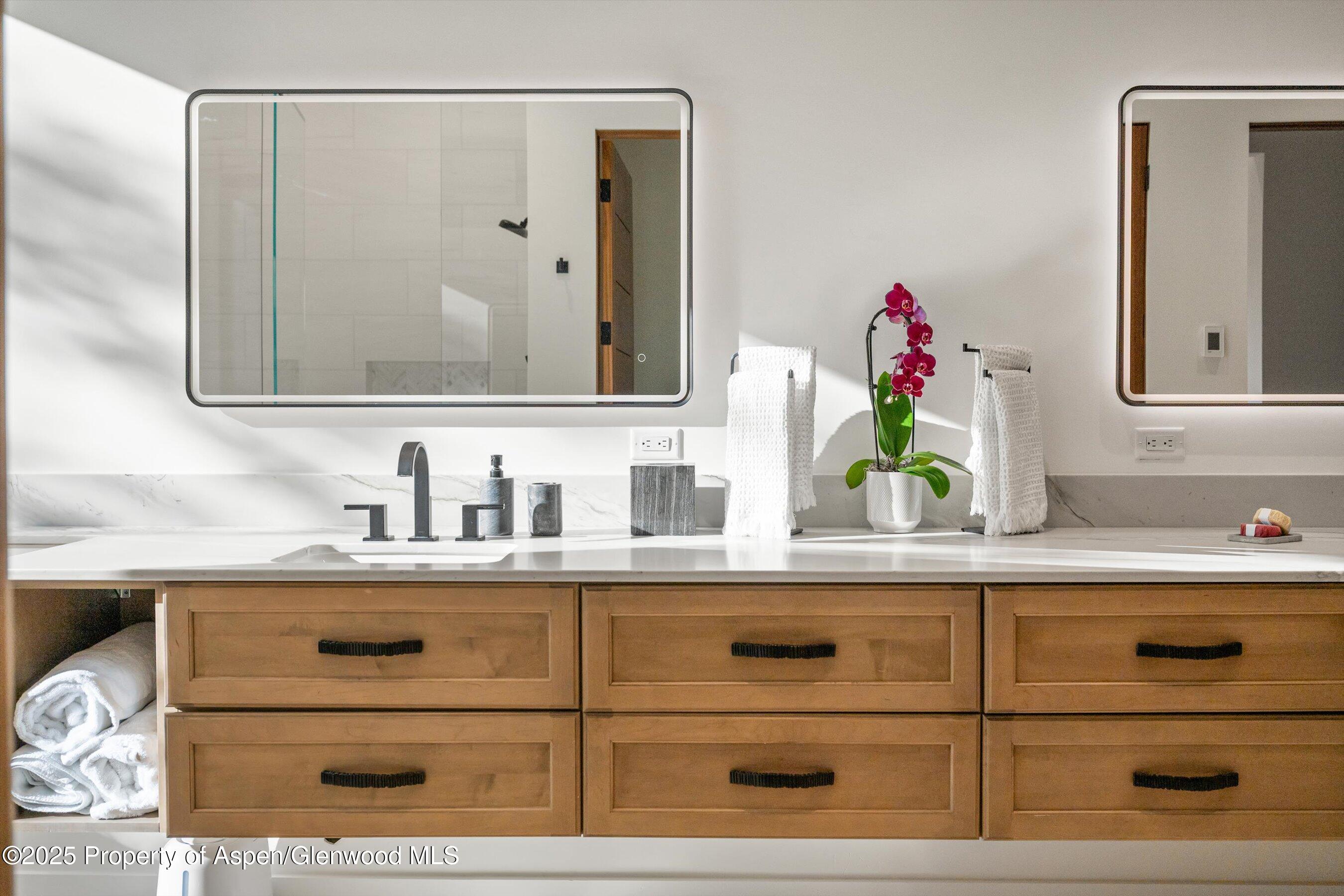 1234 Wood Road Snowmass Village, CO 81615 - Photo 45 of 66 a bathroom with a sink and a mirror