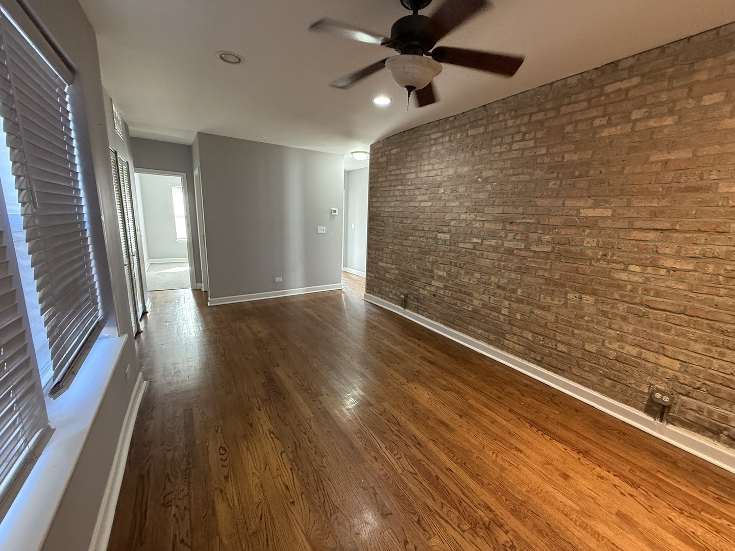 2704 West Arthur Avenue, Unit 3S Chicago, IL 60645 - Photo 5 of 11 a view of a hallway with wooden floor