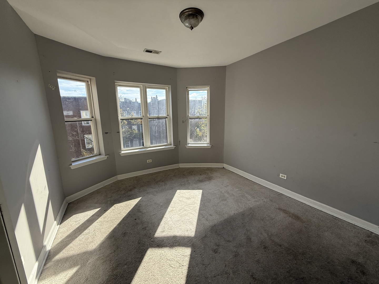 2704 West Arthur Avenue, Unit 3S Chicago, IL 60645 - Photo 7 of 11 a view of an empty room with a window