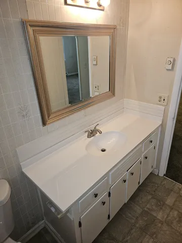 a bathroom with a sink and a mirror