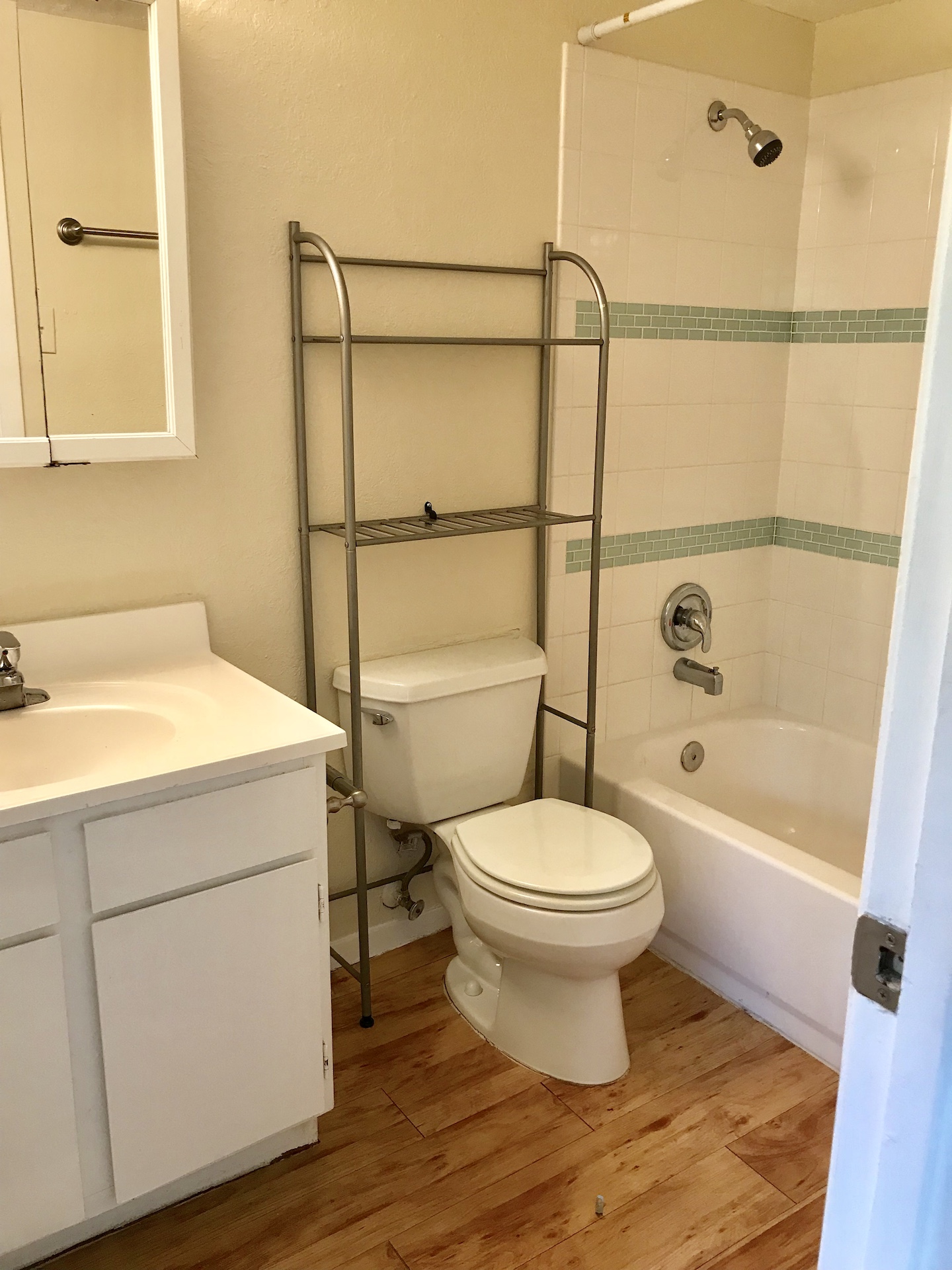 10810 Newmont Road, Unit 3 Austin, TX 78758 - Photo 6 of 8 Bathroom featuring vanity, bathing tub / shower combination, and light wood-style flooring