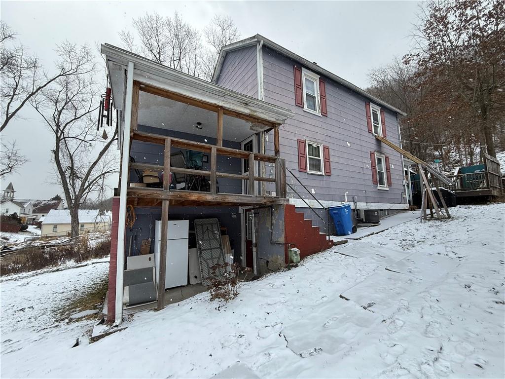 4111 Wildcat Road New Kensington, PA 15068 - Photo 17 of 21 a front view of a house with a yard covered in snow