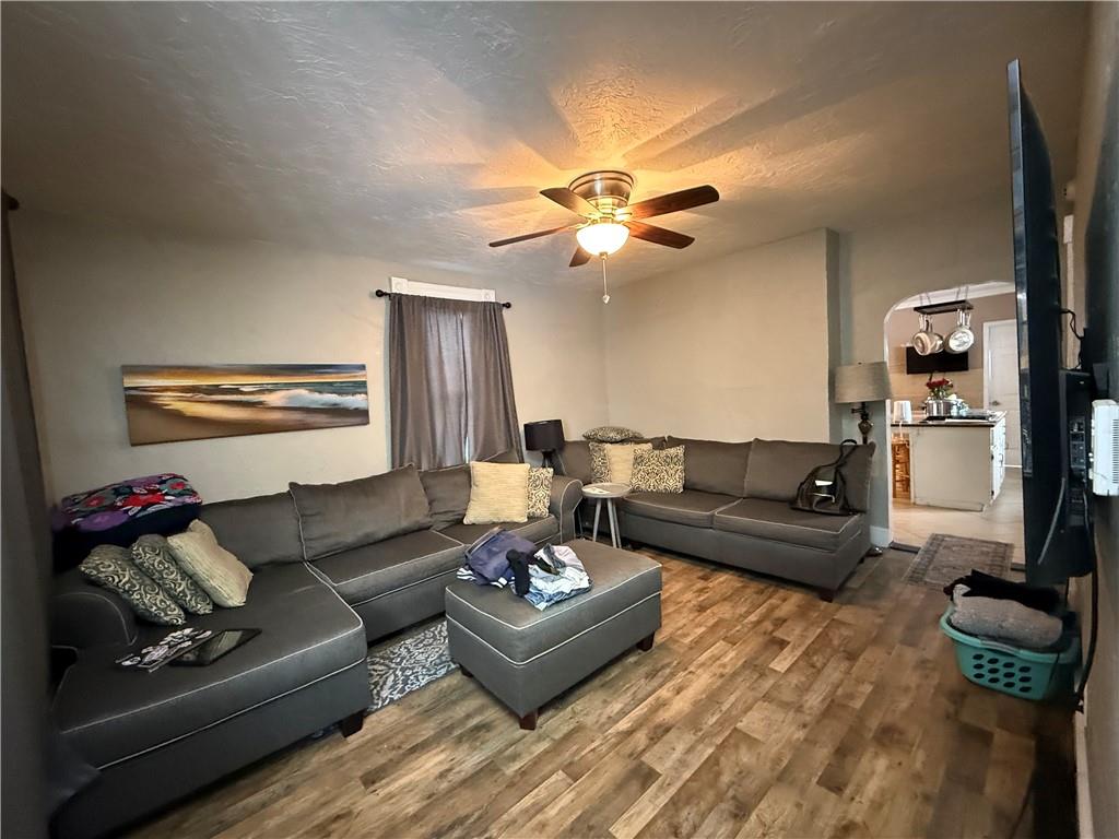 4111 Wildcat Road New Kensington, PA 15068 - Photo 4 of 21 a living room with furniture a rug and a chandelier