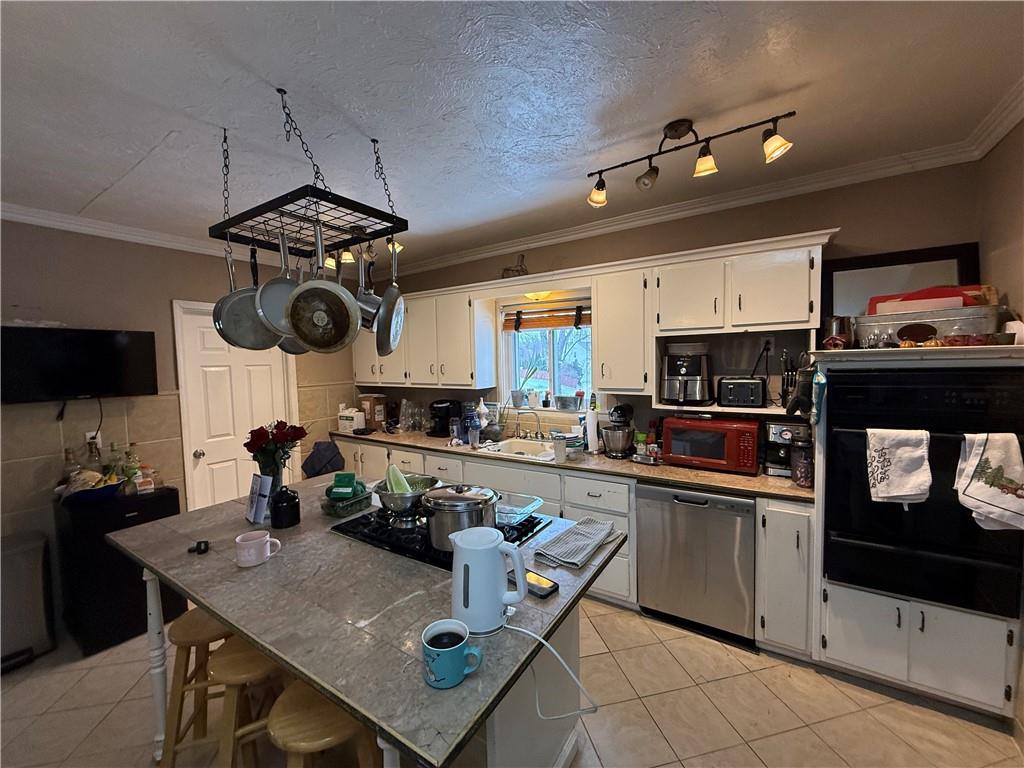 4111 Wildcat Road New Kensington, PA 15068 - Photo 8 of 21 a kitchen with a counter space cabinets and appliances