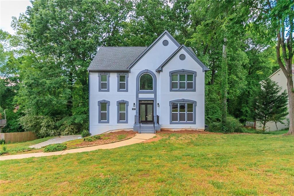 4070 Brookside Parkway Decatur, GA 30034 - Photo 1 of 1 a front view of a house with a yard