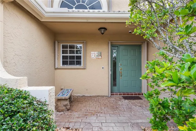 a view of a house with a tree
