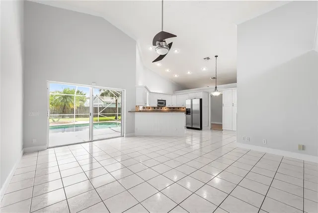 a view of an empty room and a window