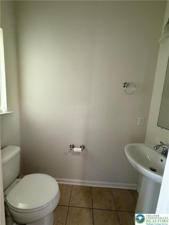 1805 Hemming Way Orefield, PA 18069 - Photo 19 of 24 a white toilet sitting next to a bathroom sink