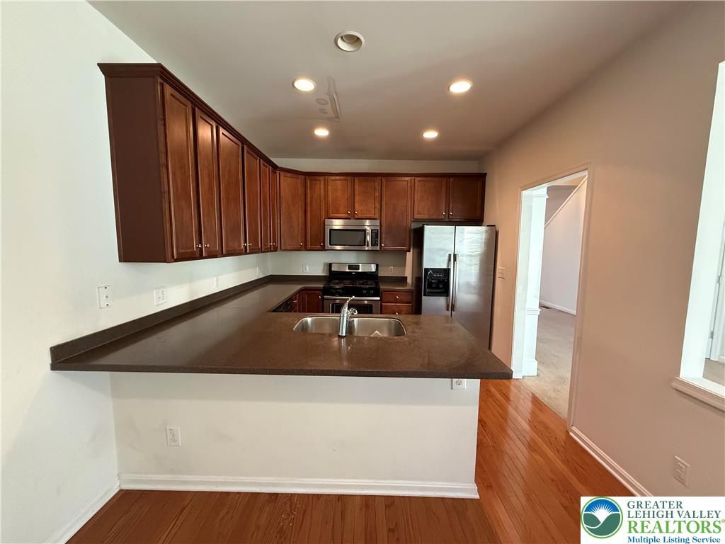 1805 Hemming Way Orefield, PA 18069 - Photo 3 of 24 a kitchen with a refrigerator and a sink