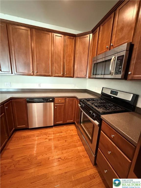 1805 Hemming Way Orefield, PA 18069 - Photo 4 of 24 a kitchen with stainless steel appliances granite countertop a stove and a sink