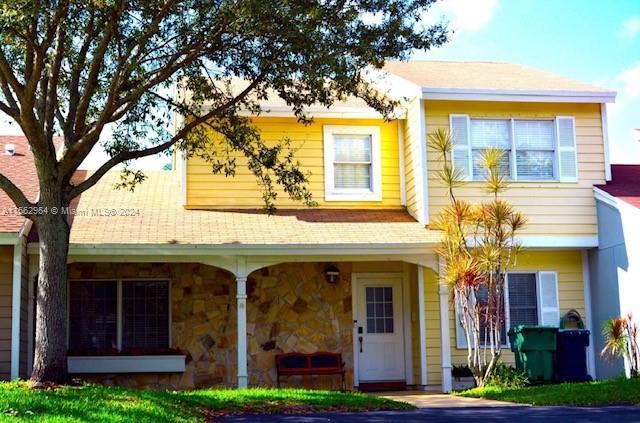 14530 Southwest 142nd Pl Circle Miami, FL 33186 - Photo 1 of 28 a view of a building with a garden