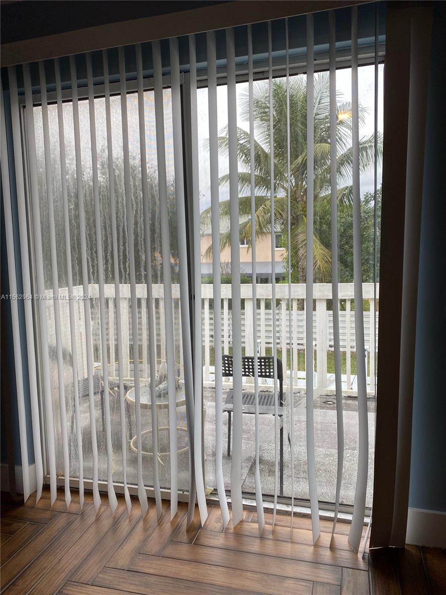 14530 Southwest 142nd Pl Circle Miami, FL 33186 - Photo 16 of 28 a bathroom with a glass door