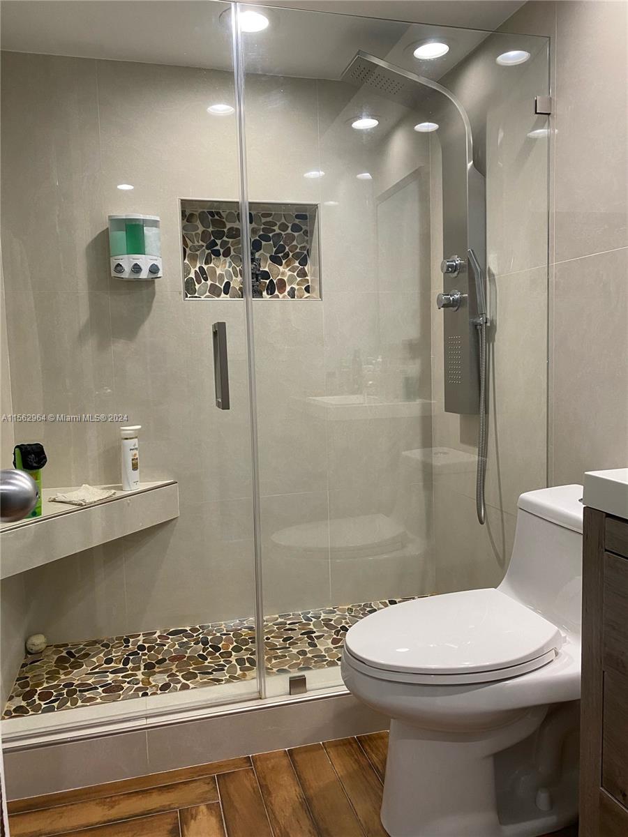 14530 Southwest 142nd Pl Circle Miami, FL 33186 - Photo 24 of 28 a bathroom with a toilet sink and shower