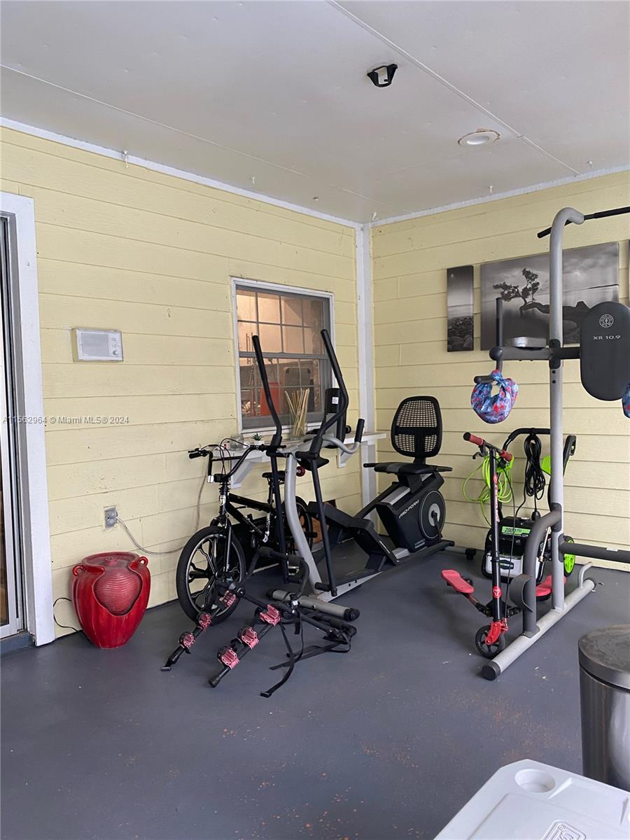 14530 Southwest 142nd Pl Circle Miami, FL 33186 - Photo 27 of 28 a view of a room with gym equipment