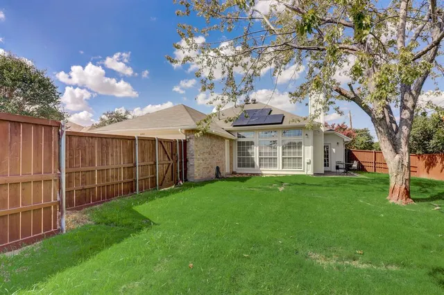 a view of a house with a garden