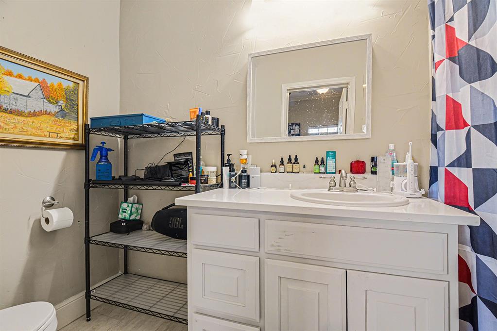 2474 McConnell Road Gunter, TX 75058 - Photo 11 of 17 a living room with furniture and a flat screen tv