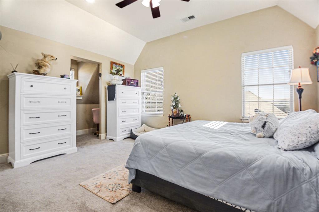 2474 McConnell Road Gunter, TX 75058 - Photo 12 of 17 a bedroom with a bed and a cabinets