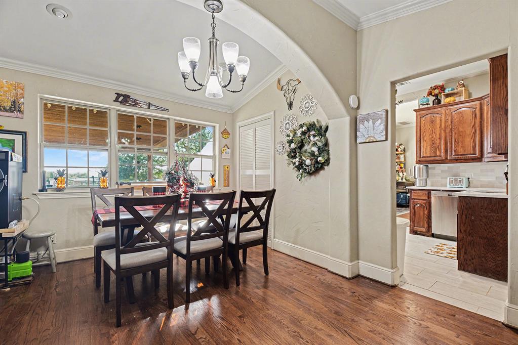 2474 McConnell Road Gunter, TX 75058 - Photo 3 of 17 a view of a dining room with furniture window and wooden floor