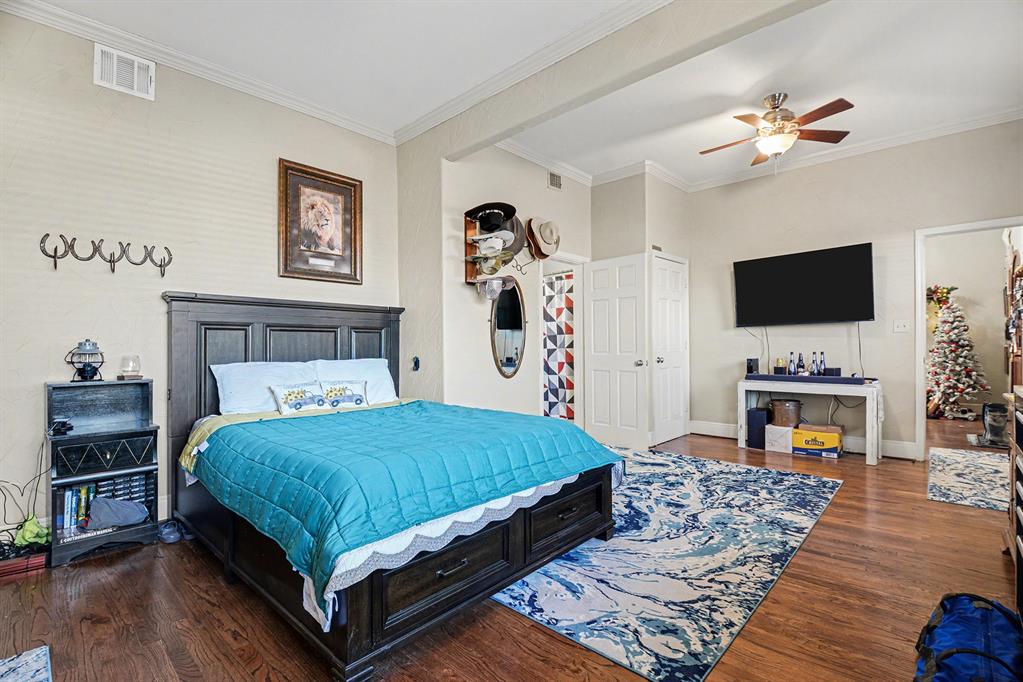 2474 McConnell Road Gunter, TX 75058 - Photo 10 of 17 a bedroom with a bed and a flat screen tv