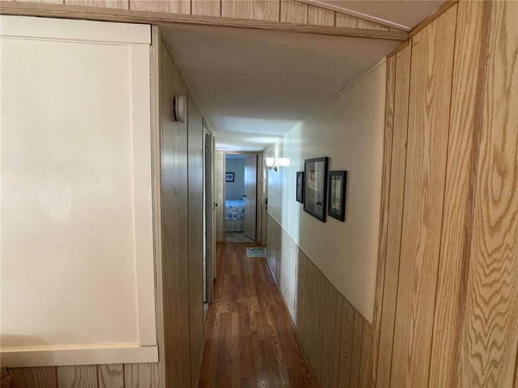 1710 7th Street Southwest, Unit 24 Ruskin, FL 33570 - Photo 16 of 44 a view of hallway with wooden floor