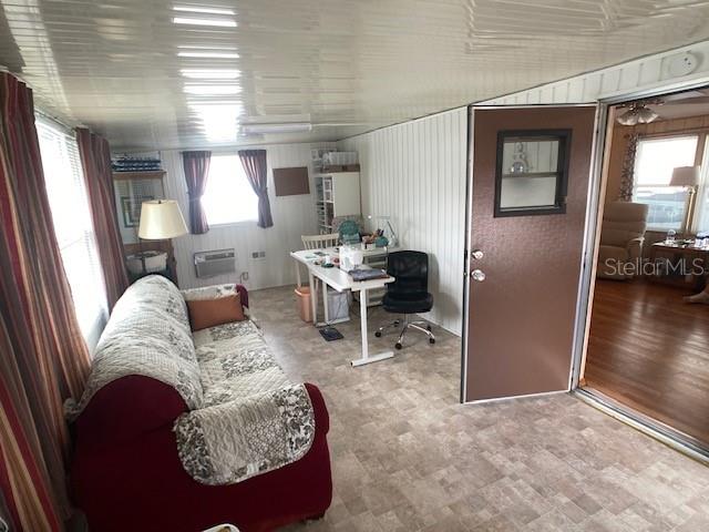 1710 7th Street Southwest, Unit 24 Ruskin, FL 33570 - Photo 17 of 44 a living room with furniture rug and a large window