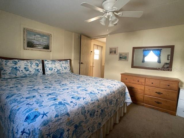 1710 7th Street Southwest, Unit 24 Ruskin, FL 33570 - Photo 20 of 44 a bedroom with a bed and a flat screen tv