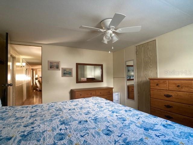 1710 7th Street Southwest, Unit 24 Ruskin, FL 33570 - Photo 22 of 44 a bedroom with a bed and a dresser