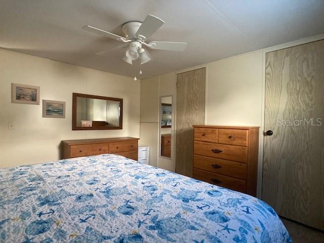 1710 7th Street Southwest, Unit 24 Ruskin, FL 33570 - Photo 23 of 44 a bedroom with a bed and a flat screen tv