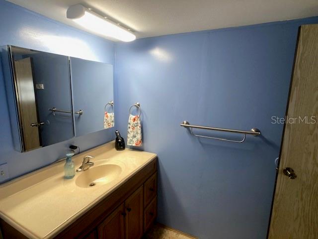 1710 7th Street Southwest, Unit 24 Ruskin, FL 33570 - Photo 26 of 44 a bathroom with a sink and mirror