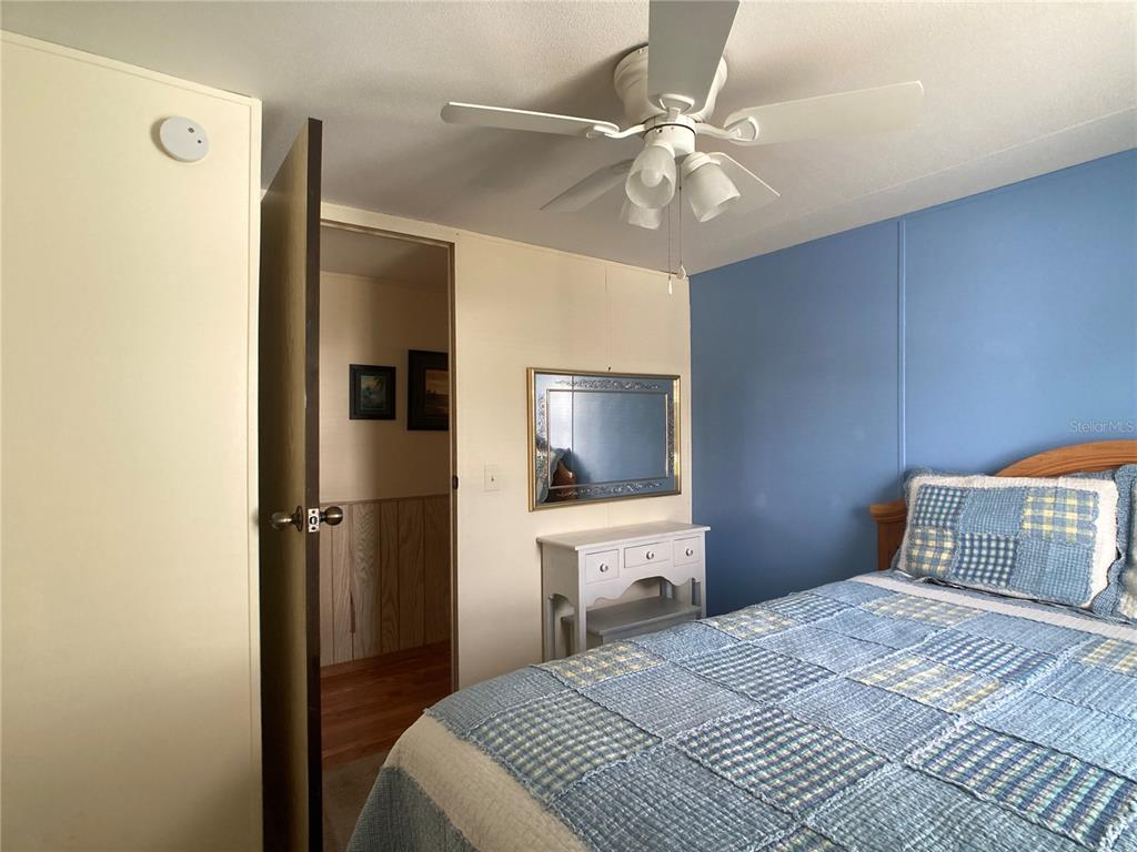 1710 7th Street Southwest, Unit 24 Ruskin, FL 33570 - Photo 28 of 44 a bedroom with a bed and a flat screen tv