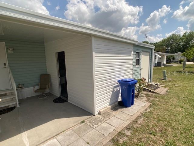 1710 7th Street Southwest, Unit 24 Ruskin, FL 33570 - Photo 31 of 44 a view of a backyard with sitting area
